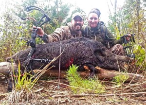 Happy couple after their trophy hog hunt